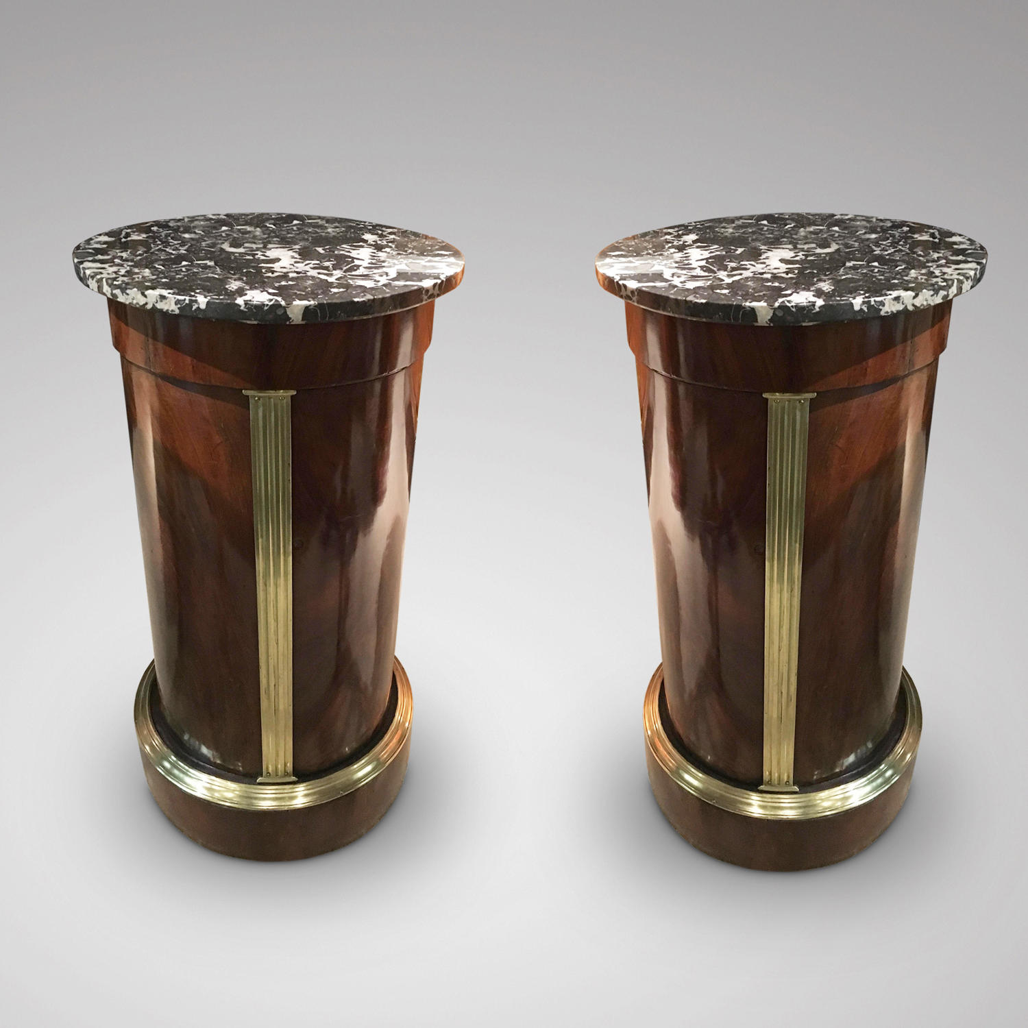 A PAIR OF BALTIC BRASS MOUNTED MAHOGANY COLUMNS