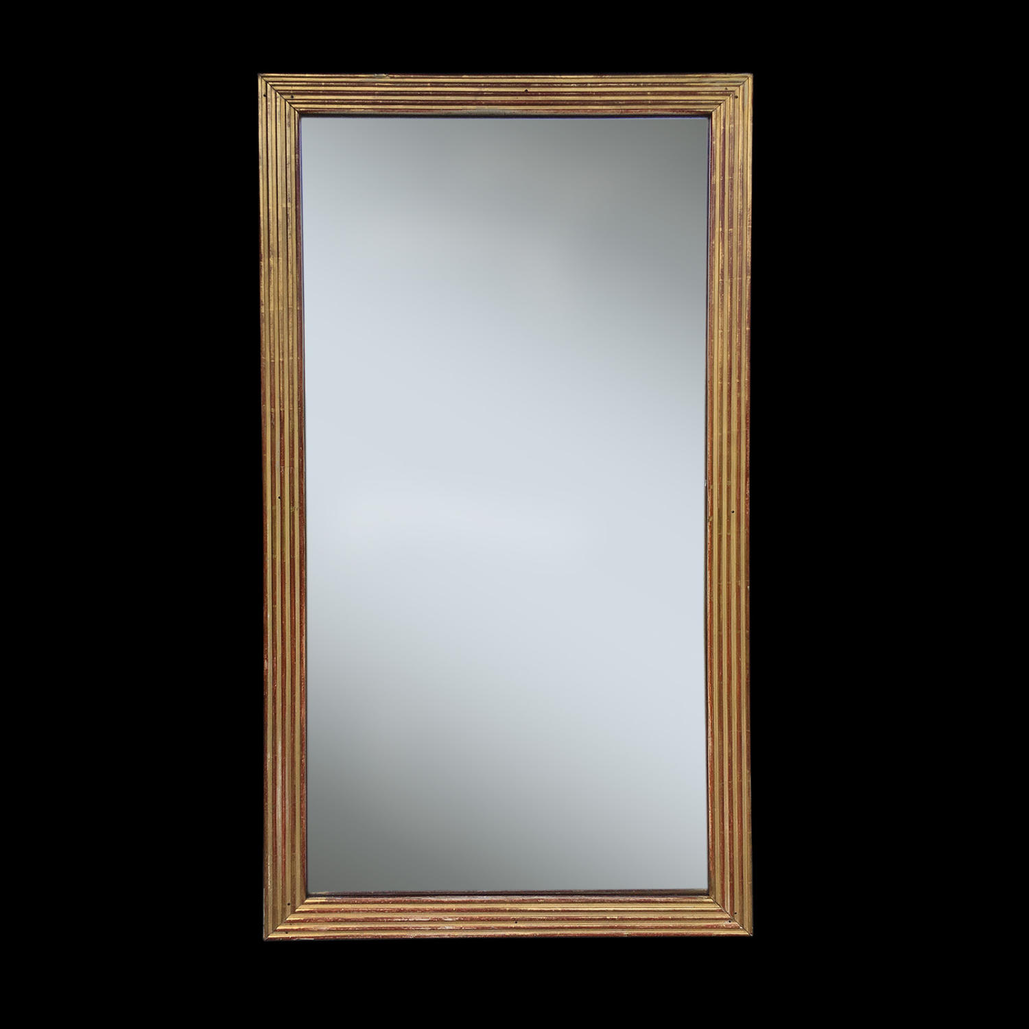 A FRENCH EMPIRE PERIOD REEDED GILTWOOD MIRROR