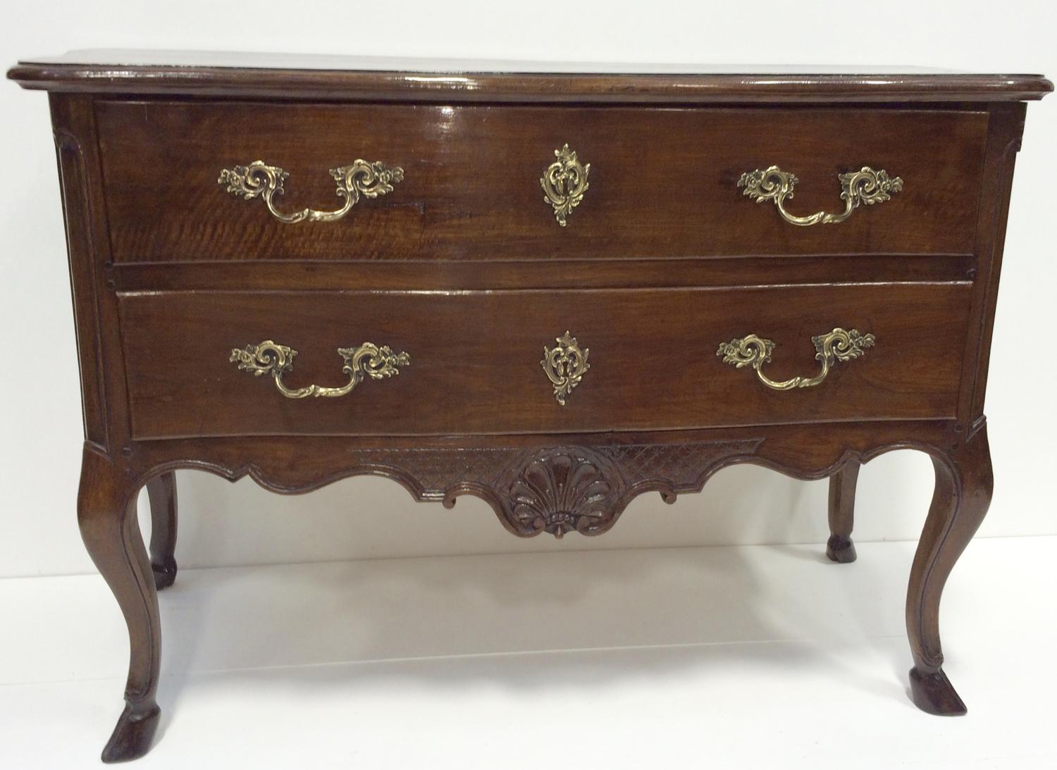 A FRENCH PROVINCIAL WALNUT COMMODE