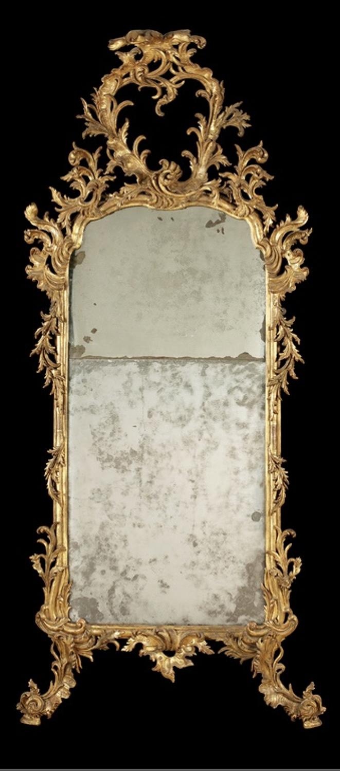 A NORTH ITALIAN LATE  C. 18TH CARVED GILTWOOD MIRROR