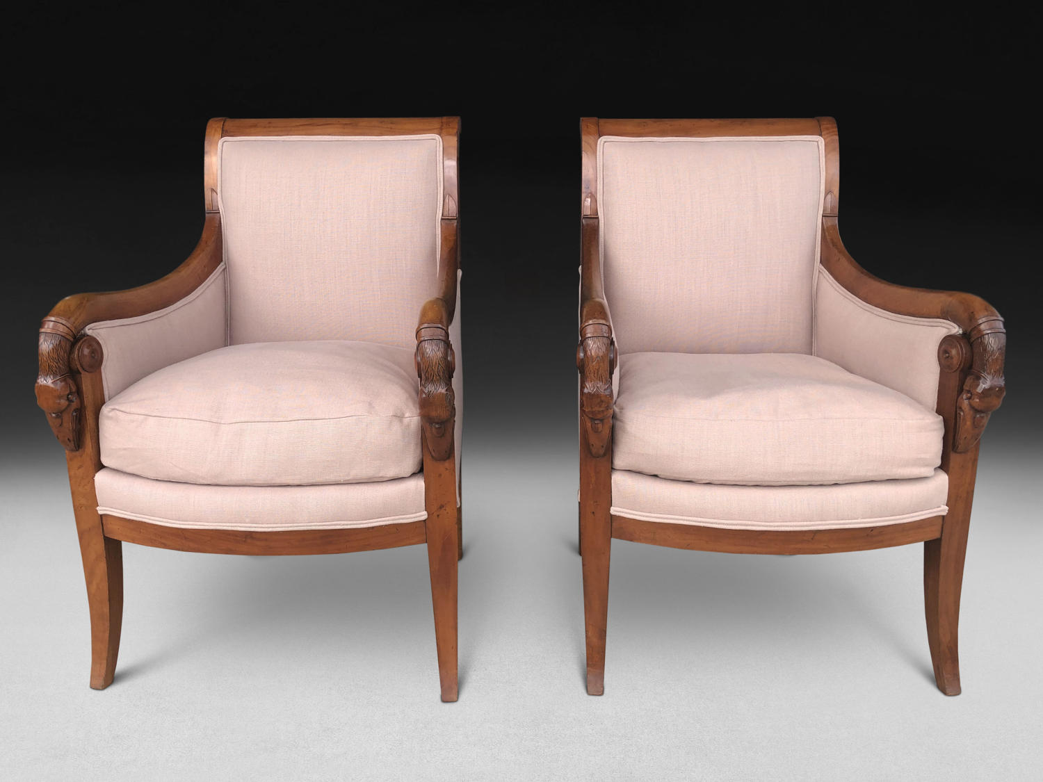 A PAIR OF EARLY 19TH CENTURY BERGERE ARMCHAIRS