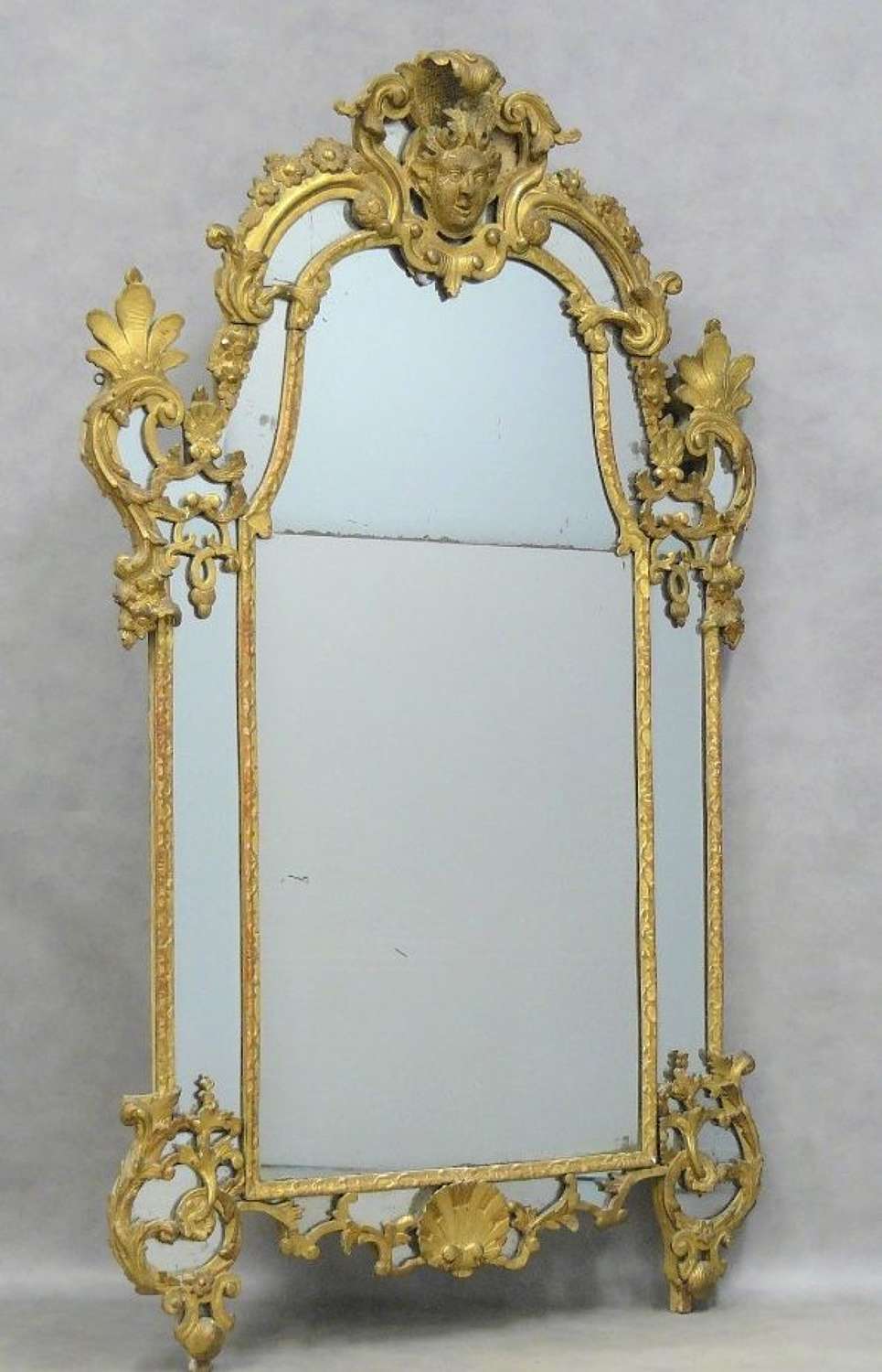 AN IMPORTANT REGENCE PERIOD CARVED GILTWOOD MIRROR