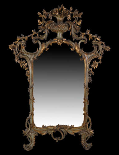 A FINE MID 18TH CENTURY BAROQUE PARCEL GILT MIRROR