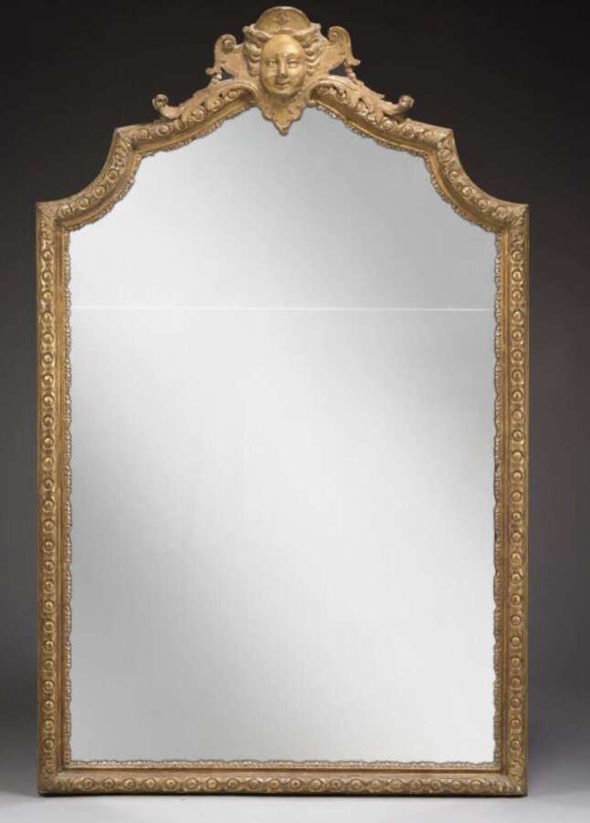 A FINE REGENCE PERIOD MIRROR WITH MASK OF DIANA THE HUNTRESS
